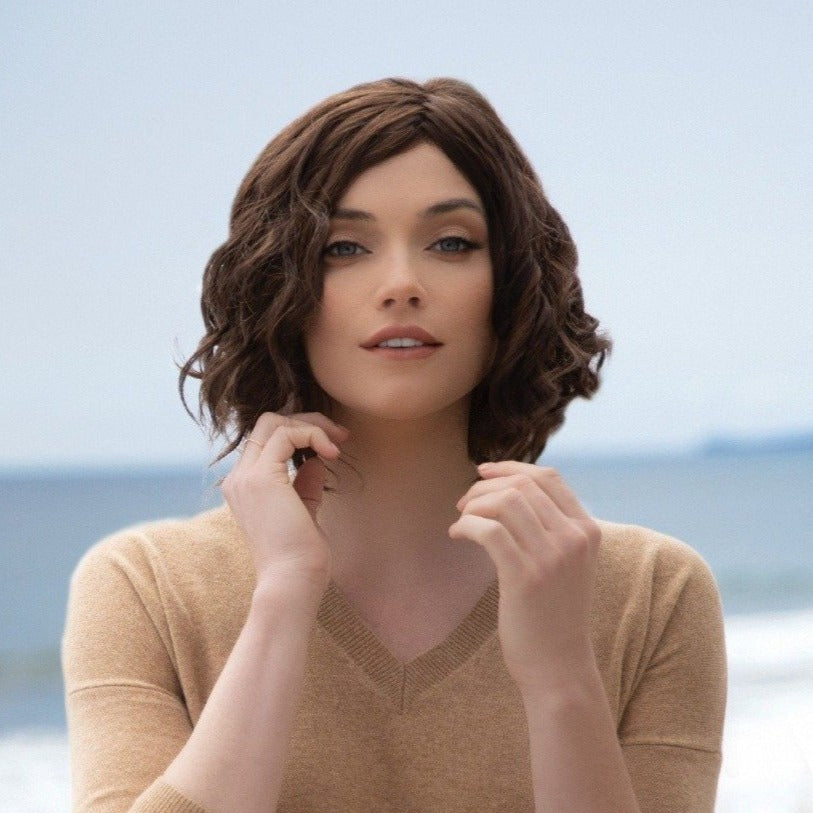 Short-length synthetic wig. This wavy ready-to-wear wig is a playful bob with spiral curls all around. This trendy bob has a new lace and front partial monofilament cap. Its lace front will give you a natural look with the partial monofilament base. Julie's cap construction has adjustable tabs in the back nape area to allow a more comfortable fit. The result is a comfortable fit with a natural look that is both fashionable and easy to wear.