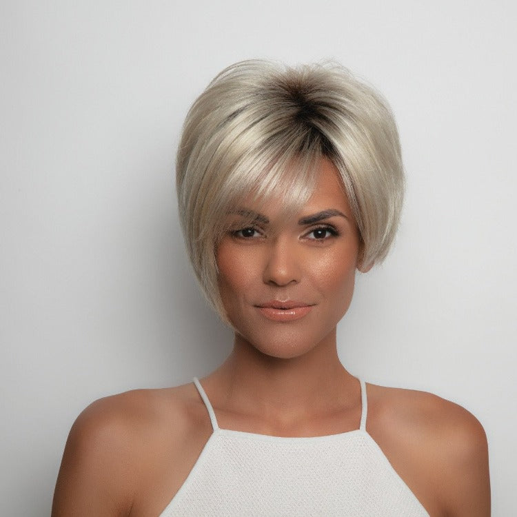 Short-length synthetic wig. This straight ready-to-wear wig is a classic cut with short layers featuring side swept fringe and tapered nape. Susanne is machine made with adjustable tabs in the back nape area to allow a more comfortable fit. The result is a comfortable fit with a natural look that is both fashionable and easy to wear.