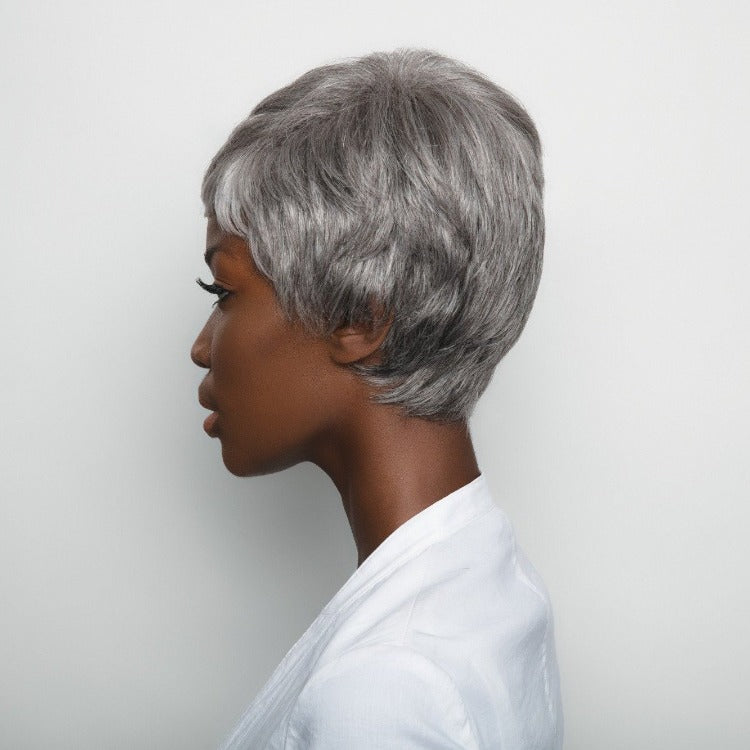 Short-length synthetic wig. This straight ready-to-wear wig is a fashion forward pixie with tapered nape. Gabby is machine made with adjustable tabs in the back nape area to allow a more comfortable fit. The result is a comfortable fit with a natural look that is both fashionable and easy to wear. Shown in Silver Stone