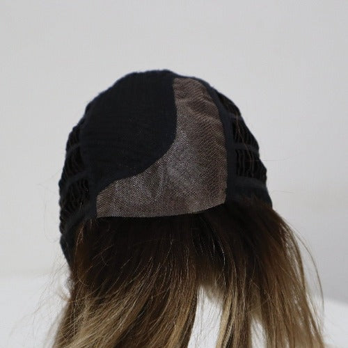 Lace front cap with a monofilament part for a natural hairline and parting area.