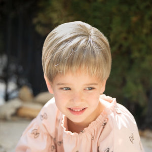 Synthetic childrens short unisex style wig with bangs.  Lace front and lace part cap make this a realistic option.  Shown in Creamy Toffee.